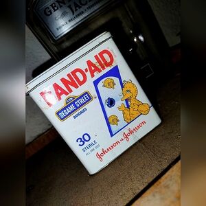 Vintage bandaid tin can